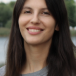 a dark hair woman looking at the screen