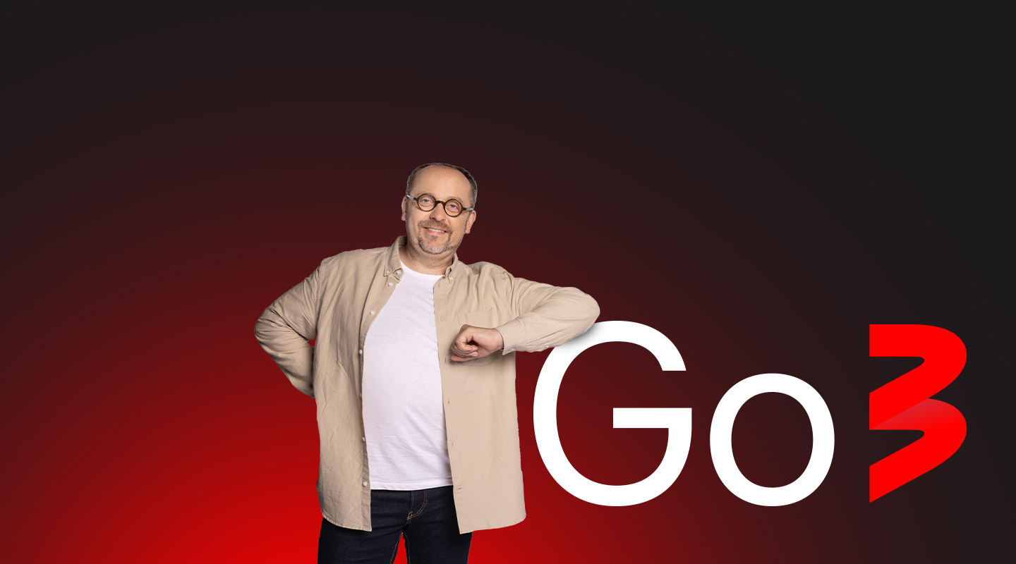 man standing next to go3 sign